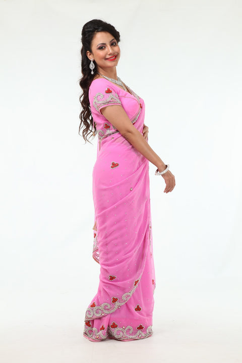 Blushing Beauty in Pink Sari with Silver Beaded Border
