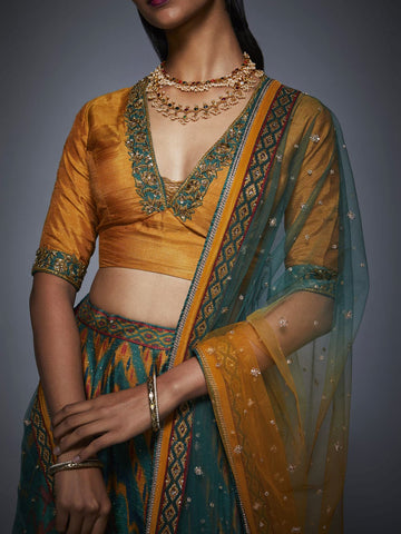 Image Title RI-Ritu-Kumar-Bottle-Green-And-Mustard-Ikat-Lehenga-Set-CloseUp