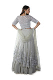 Light Green Floral Rexin Embroidered Blouse with an Asymmetrically Layered Lehenga paired with a Dupatta