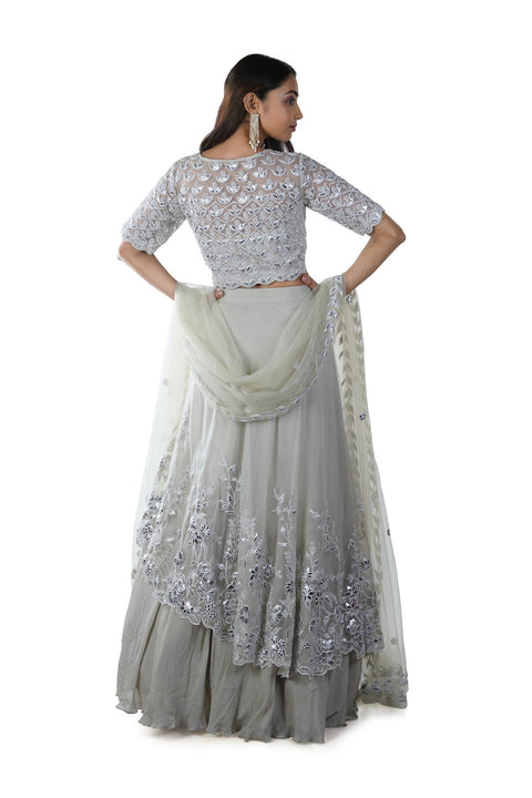 Light Green Floral Rexin Embroidered Blouse with an Asymmetrically Layered Lehenga paired with a Dupatta