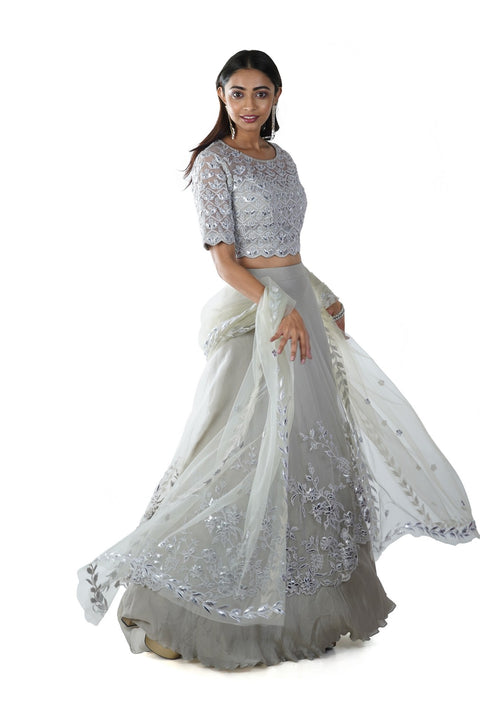 Light Green Floral Rexin Embroidered Blouse with an Asymmetrically Layered Lehenga paired with a Dupatta