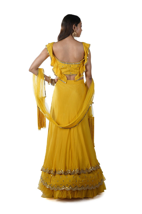 Mustard Yellow Mirror Embroidery Blouse paired with a Double Layered Ruffle Lehenga & Tassel Dupatta