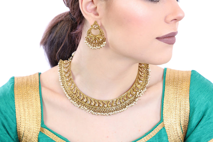 Glorious Gold Necklace Set with Earrings - 1052