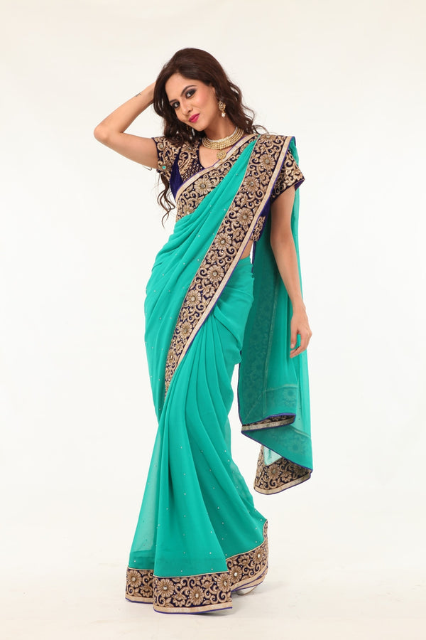 Enchanting Beauty Mint Colored Sari with Rich Blue Border