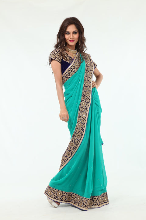 Enchanting Beauty Mint Colored Sari with Rich Blue Border