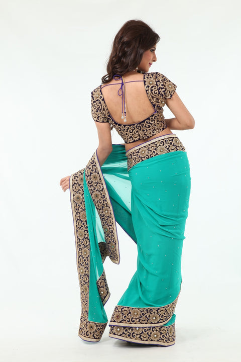 Enchanting Beauty Mint Colored Sari with Rich Blue Border