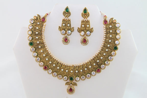 Charming Traditional Gold Kundan Necklace Set with Earrings and Tika