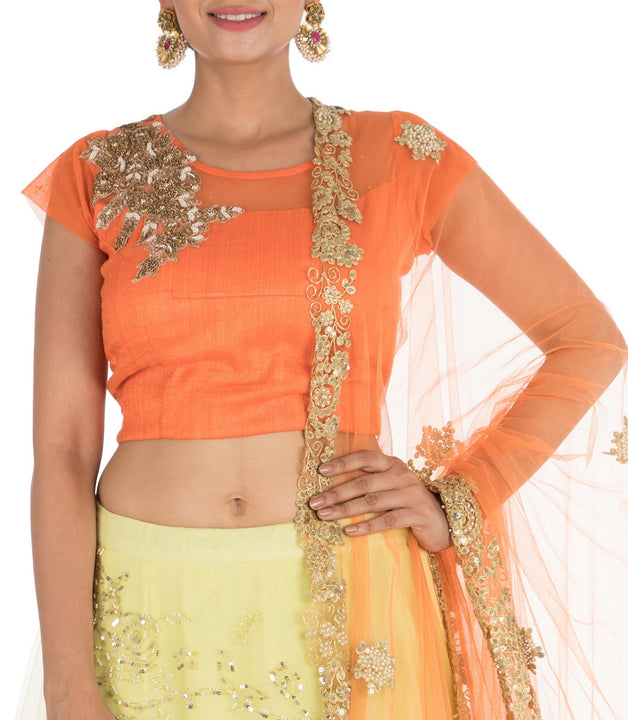 Hand Embroidered Bright Yellow And Orange Net Lehenga Set